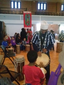 Teli runs kids' drum circle at KwanzaaFest 2014